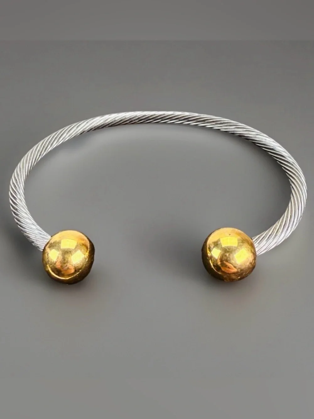 Pretty silvertone and goldtone, twisted cuff bracelet